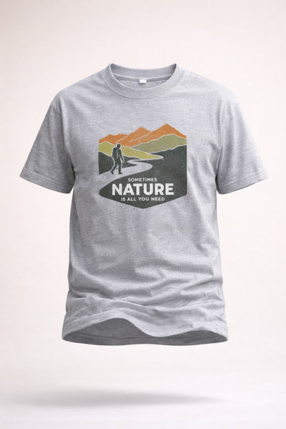 Gray t-shirt with nature graphic and text on a light gray background